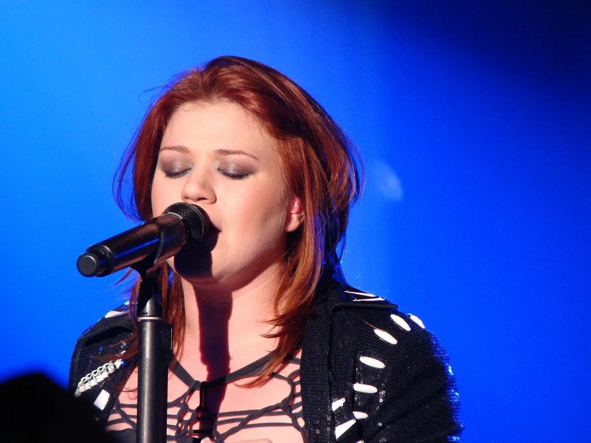 Kelly Clarkson performing on stage in 2010